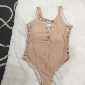 Brand new without tags tan one piece swimsuit
